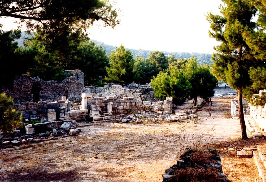 Ancient harbor and ruins of Phaselis with pine trees and Mediterranean Sea